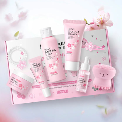 Conjunto de 8 peças de cuidados com a pele Sakura: Limpador facial, tônico, essência, creme para os olhos, creme essência, presilha de cabelo, elástico de cabelo, polvo rosa.