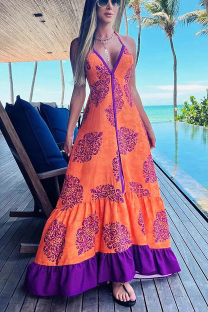 Vestido de verão elegante com estampa fashion, modelagem slim, decote V profundo e alças halter, ideal para festas e praia.