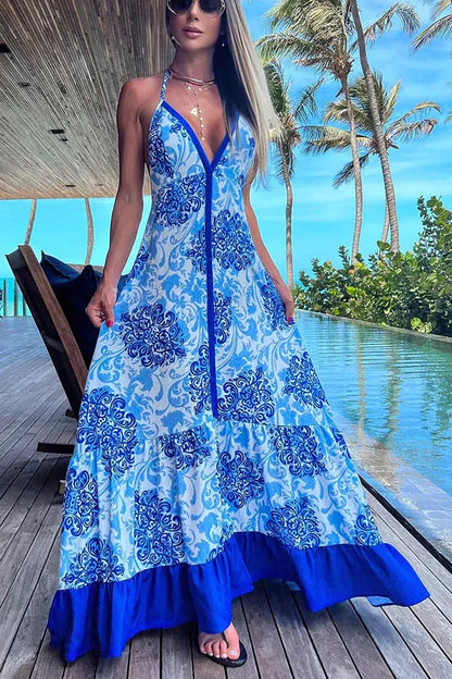 Vestido de verão elegante com estampa fashion, modelagem slim, decote V profundo e alças halter, ideal para festas e praia.